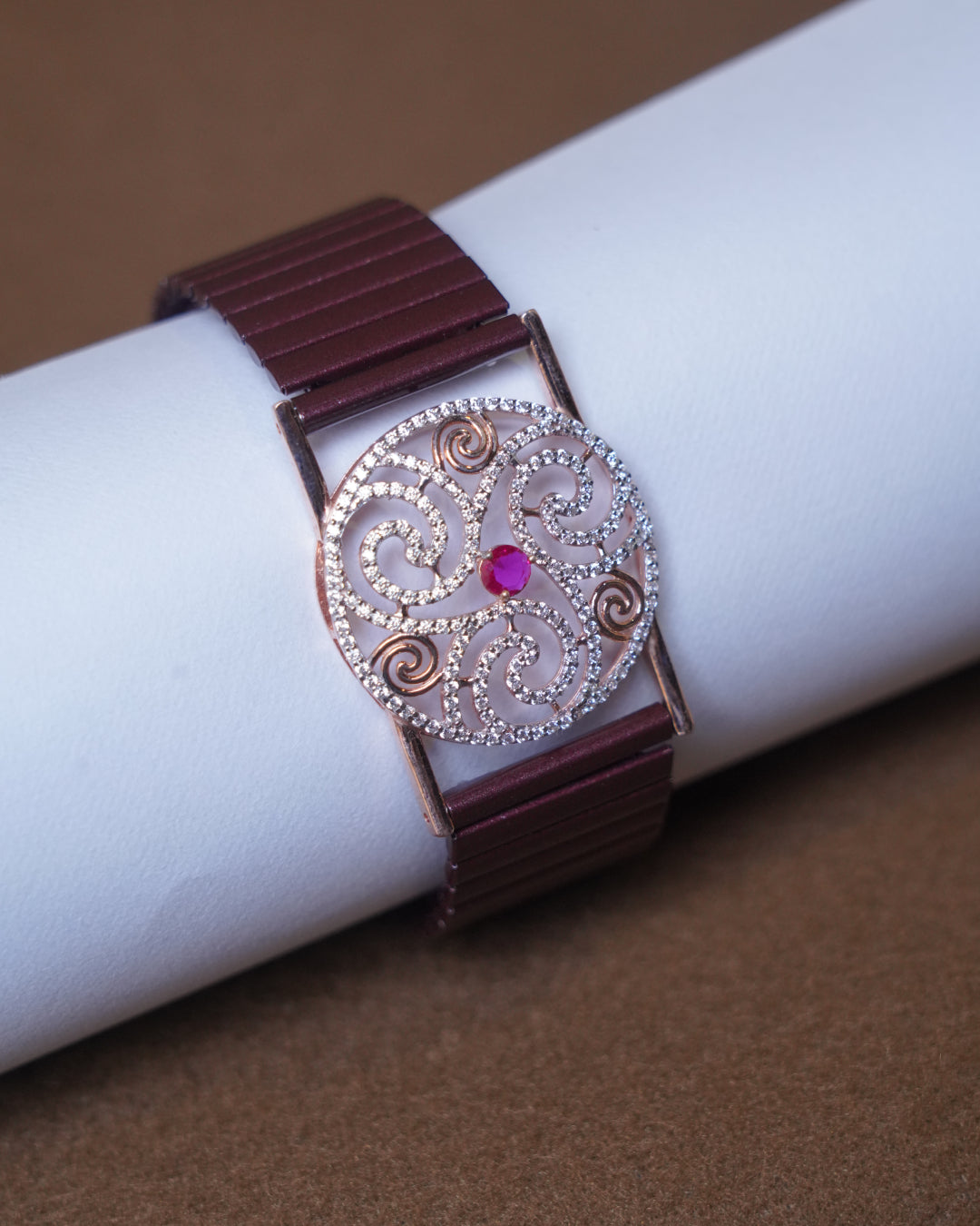 Rose Gold Spiral Stone Bracelet with Ruby Accent – Free Size