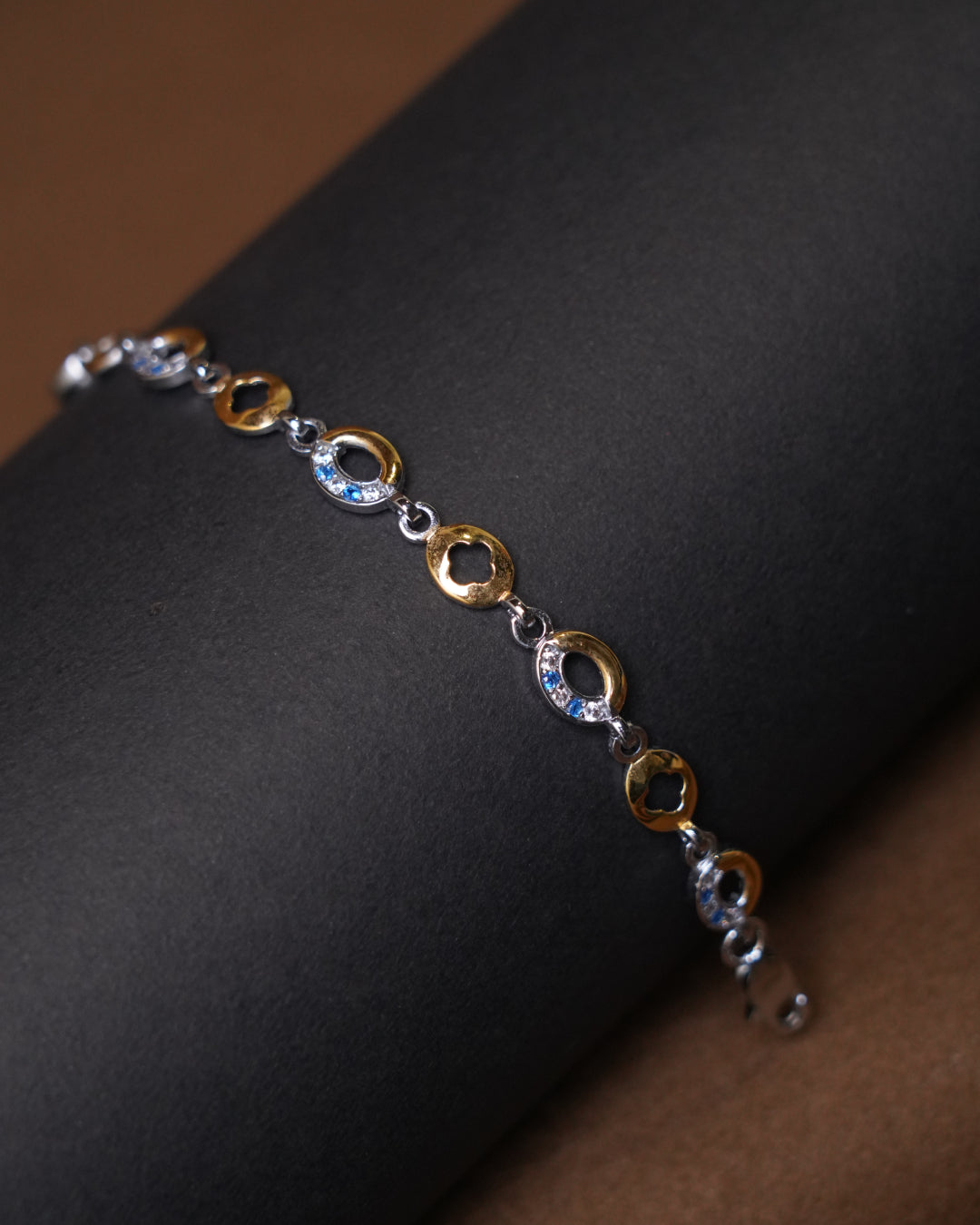 Modern Two-Tone Gold Bracelet with Blue Stone Accents (7 Inch)