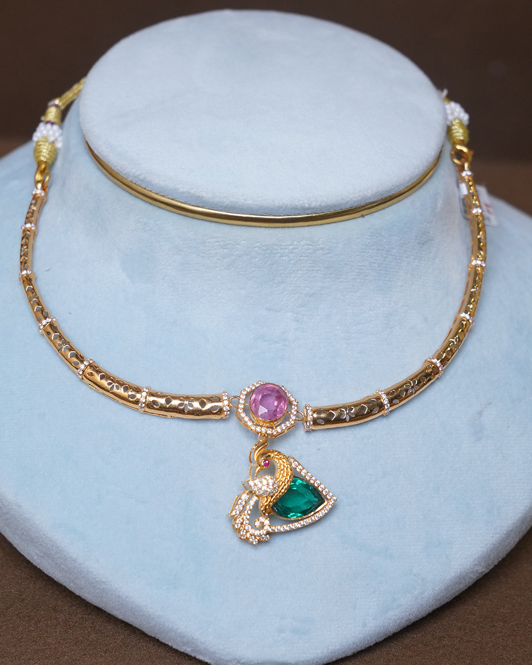 Designer Gold Peacock Pendant Necklace with Pink & Green Stones